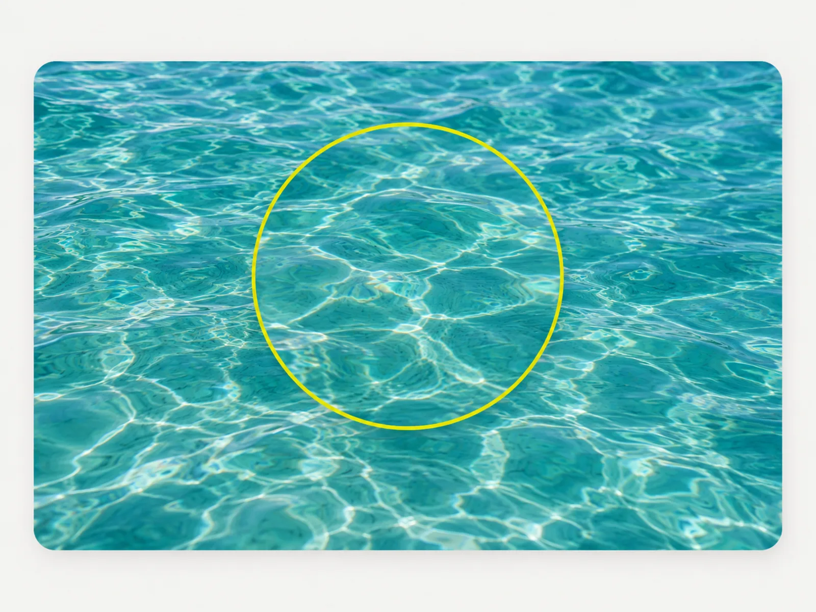 A magnifier over rippling water showing seamlessly rebuilt texture inside the loupe